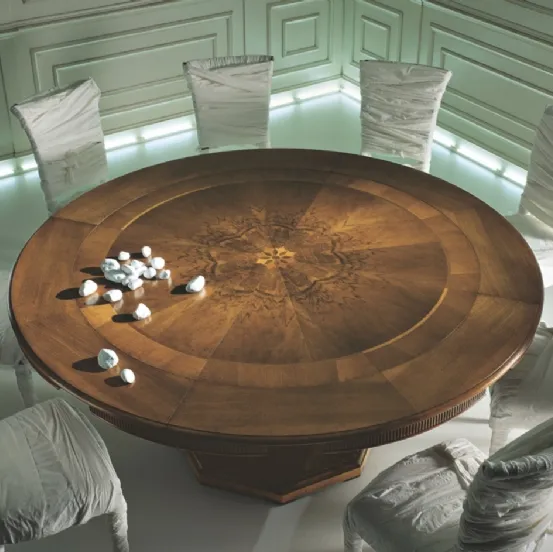 Tavolo rotondo con piano lavorato a disegno figurato in Noce fiammato con finiture in Ciliegio Magnifico de L'Origine